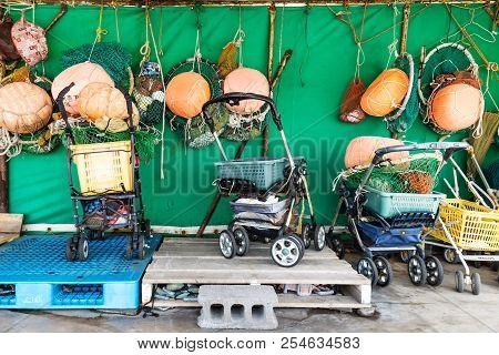 Jeju-si, Jeju Island, South Korea - August 31 2017: Fishermen Equipment And Nets In Pushcars At The 