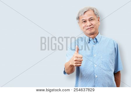 Portrait Of Happy Senior Asian Man Gesture Hand Showing Thumb Up Or Good Sign And Looking At Camera 
