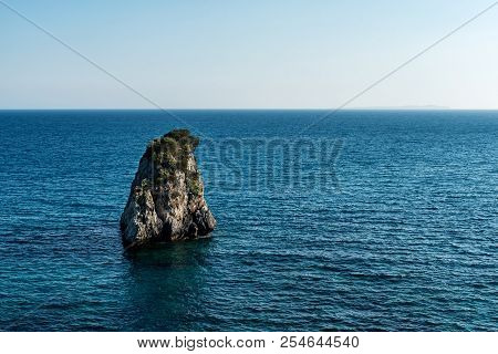 Lonely Inhospitable Uninhabited Island In Blue Ionian Sea In Greece