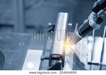 The Welding Robot Machine For Welding Automotive Part In The Light Blue Scene.industrial 4.0 Concept