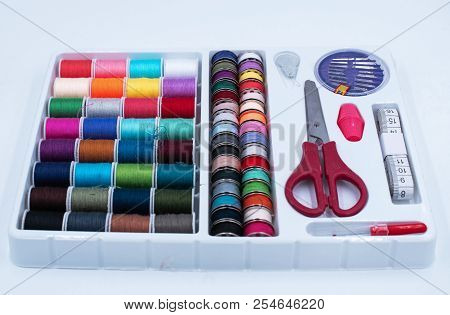 The Sewing Boxset.there Are Colorful Thread,scissor,measuring Tape And Needle,on White Background