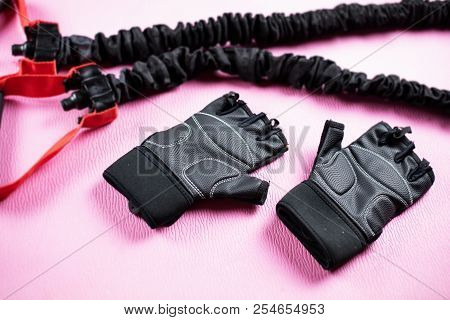 In Slective Focus Of Fitness Gloves Put On Yoga Mat,the Accessoried For Training,blurry Light Design