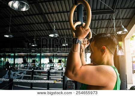 Asian Man Athlete Gymnast Rings Exercise In Gymnastics Exercise Chest