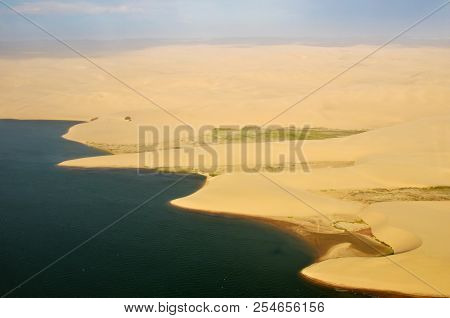 Aerial View On The Coast In Namibia Where Dunes Of The Namib Desert Meet With Atlantic Ocean, Africa