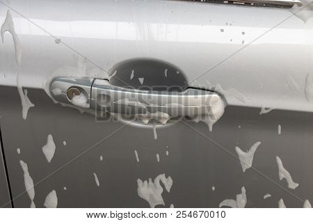 Soap Foam On A Car Door Handle