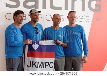 ST. PETERSBURG, RUSSIA - AUGUST 3, 2018: Sailing team JK MIPC from Slovenia make group photo during Semifinal 2 of Sailing Champions League. 25 sailing teams take part in the competitions