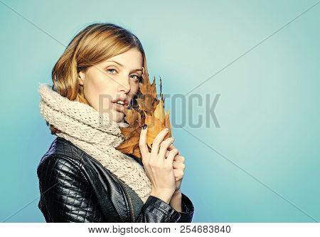 Season And Autumn Holiday. Beauty And Fashion. Woman With Autumn Leaves In Leather Jacket. Fashion M