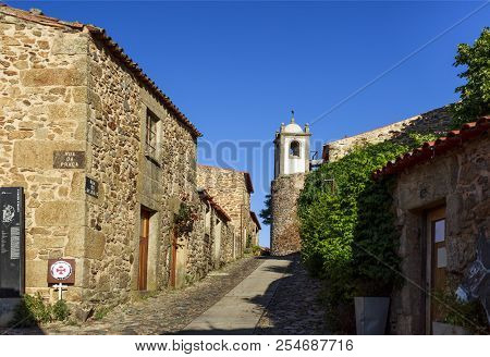 Castelo Rodrigo, Portugal - June 19, 2018:  View Of The Cobble Street Leading To The Clock Tower And