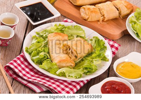 Spring Rolls With Soja Dip On White Dish.