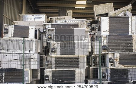 Huge Piles Of Refrigerators Stacked At Recycling Plant. Low Angle View