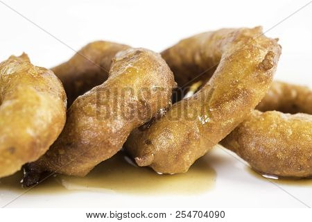 Picarones: These Are Ring-shaped Dessert Made With Wheat Flour Dough Mixed With Pumpkin And Sweet Po