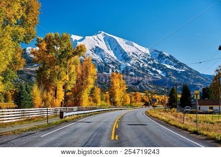 Highway in Colorado Rocky Mountains at autumn, USA. Mount Sopris landscape.