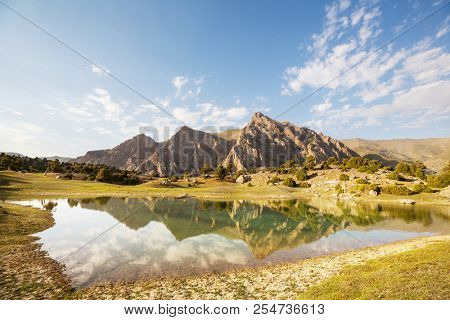 Beautiful serene lake in  Fann mountains (branch of Pamir) in Tajikistan.
