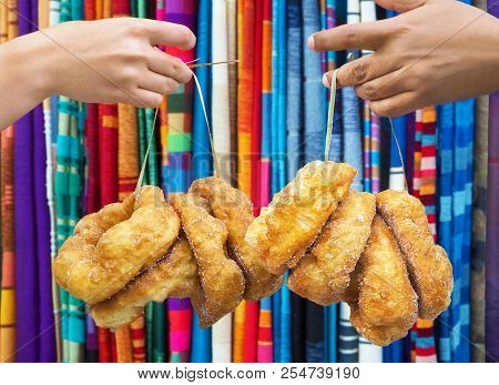 Hand Holding Traditional Fresh Baked Donuts In Morocco