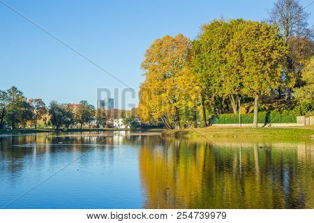 Pond In Riga, District Agenskalsns. Autumn, Yellow Tree Leaves, Lake And Reflection. 2017