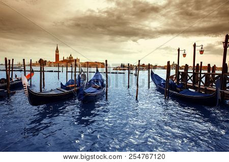 Gondolas In Lagoon Of Venice On Sunrise