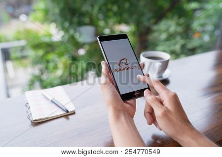 Chiang Mai, Thailand - August 18,2018: Woman Hands Holding Huawei With Alibaba Apps On Screen.alibab