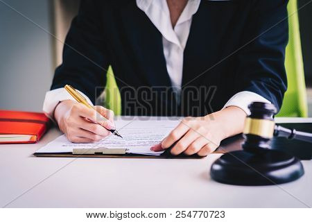 Professional Female Lawyers Working At The Law Firms. Judge Gavel With Scales Of Justice. Legal Law,