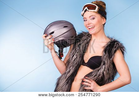 Winter Sport Activity Concept. Atractive Smiling Woman Wearing Black Bra, Ski Goggles And Furry Wais