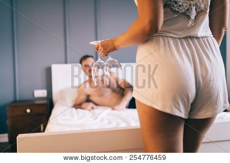 Attractive Sexy Woman With Her Partner In Bedroom