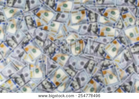 Blurred Background With Stack Of One Hundred Dollar Bills. Blur Stack Of Cash Money In Hundred Dolla