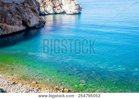Jebha Island And Waves And Rocks