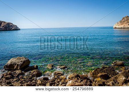 Jebha Island And Waves And Rocks