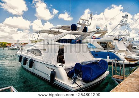 Luxury Yachts Docked In The Port In Bay At Sunny Day With Clouds On Blue Sky In La Romana, Dominican