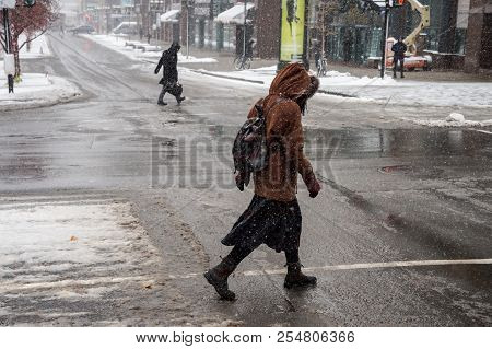 Montreal, Ca - 21 November 2016: First Snowfall Of The Season Hits The City. Pedestrians On Mcgill C