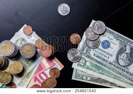 Euros And Usa Dollars Banknotes And Coins With Russian One Ruble Coin On Black Background. Concept O