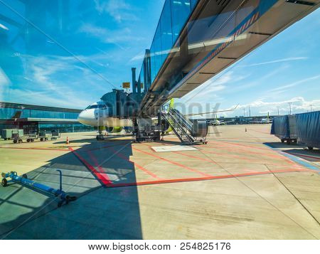 Riga, Latvia - July 8, 2018: Airbaltic airlines airplane boarding at the domestic airport at day time