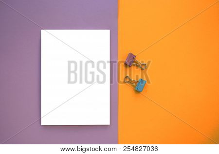 Notepad And Binder Clips On Colorful Background With Copyspace.