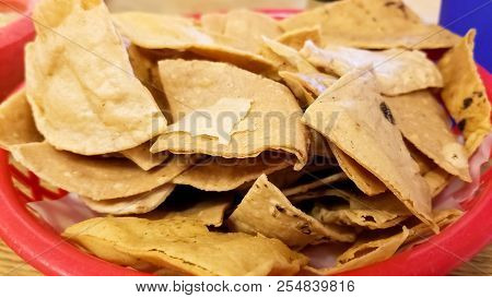 Delicious Crunchy Totopos Or Hard Tortilla Chips. Typical Traditional Mexican Food.