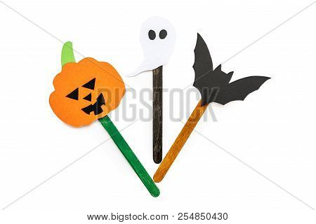 Halloween Concept. Creative Halloween Hand Made Bookmark Wth A Pumpkin On A Craft Stick Isolated On 