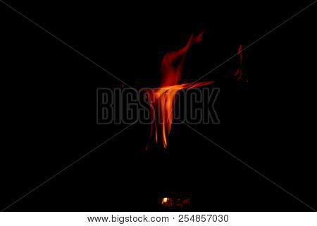 A Dancing Fire In A Fireplace On A Black Background, A Fire Texture, A Red Flame.