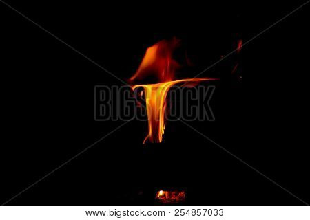 A Dancing Fire In A Fireplace On A Black Background, A Fire Texture, A Red Flame.