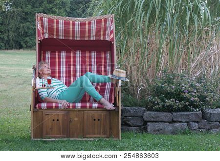 Styled With Green Painted Toenails And A Stetson Sun Protection For The Feet, This Woman Enjoys The 