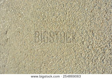 Yellow Bright Background, Construction Wall With Very Small Glass Stones Matte White And Gray With A