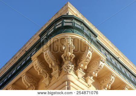 Symmetric Central Corner View Of Facade Wity Big Traditional Balcony Of Grandmaster Palace In Vallet