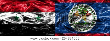 Syria Vs Belize Smoke Flags Placed Side By Side. Thick Colored Silky Smoke Flags Of Syrian And Beliz