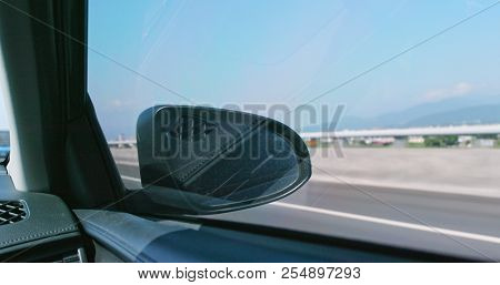 Car driving though highway