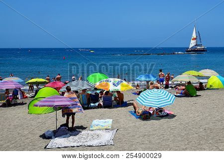 Costa Adeje,tenerife,spain - July 20, 2018:view On Playa De Torviscas With Colorful Beach Umbrellas.