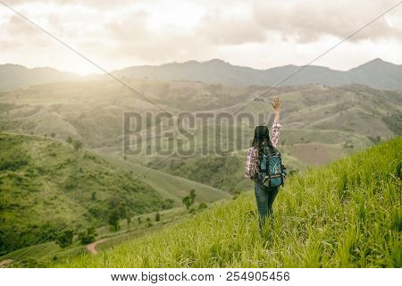 Asian Young Woman Enjoy And Stretching Her Arms With Sky Background In Nature Rice Farm, Her Is Feel