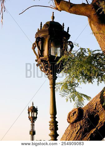 Lamppost Of Light In The Gardens Of Alameda Apodaca In Capital Of Cádiz, Andalusia. Spain. Europe.