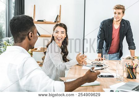 Multiethinc Business Coworkers Having Conversation During Conference In Office