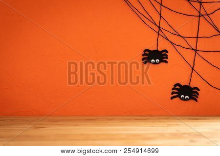 Halloween Crafts, Spide And Cobweb On Orange Background With Copy Space For Text On Wooden Table. Ha
