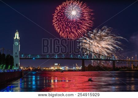 Fireworks Display Over City Bridge During International Fireworks Festival In Montreal