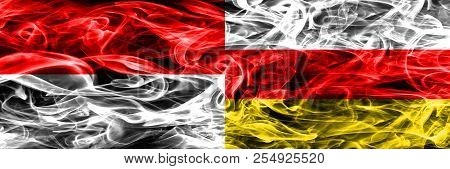 Indonesia Vs South Ossetia Smoke Flags Placed Side By Side. Thick Colored Silky Smoke Flags Of Indon