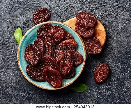 Dried Brown Apricots On Gray Background. Top View.