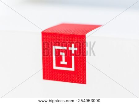 Khakiv, Ukraine - 14 August 2018: Red square logotype of smartphone OnePlus 6 with white background